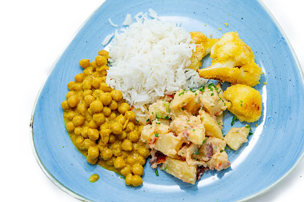 Chickpeas curry with white basmati rice, Crispy Breaded Cauliflower and potato salad