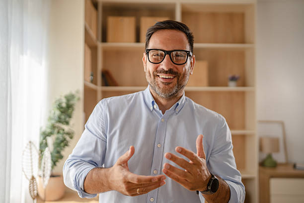istock Smiling businessman making a video call from home office 2235438777