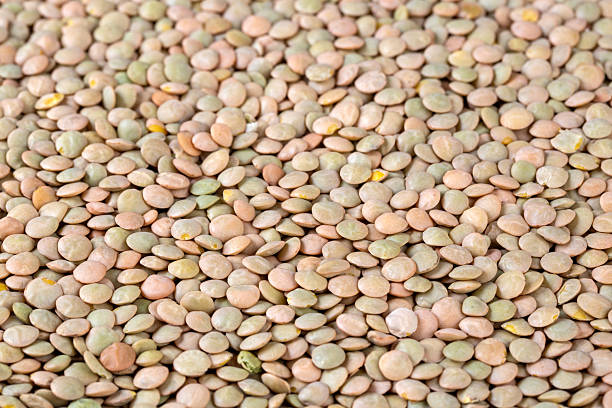 istock Green lentil on the white background 2235441926