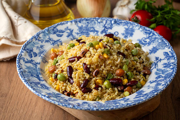 istock Bulgur pilaf with legumes; with peas, beans and corn kernels. 2235442273