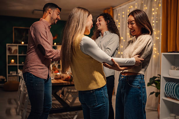 istock Friends enjoying a festive evening together, dancing and celebrating 2235444088