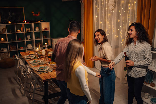 istock Friends dancing and having fun at thanksgiving dinner party 2235444089