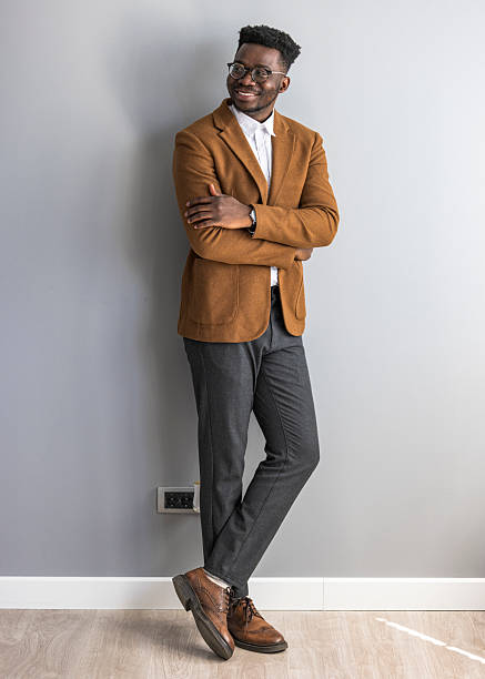 istock Confident Young Professional in Stylish Attire Against Minimalist Background 2235445421