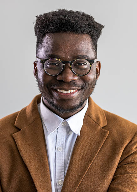 istock Smiling Professional Man Wearing a Brown Jacket and Glasses 2235445422