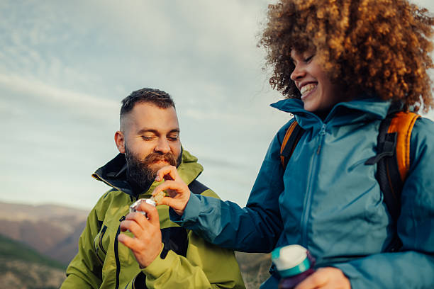 istock Hikers sharing food during mountain trip 2235448699