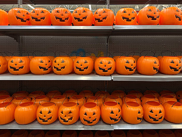 istock Plastic pumpkins buckets ready for Halloween 2235452346