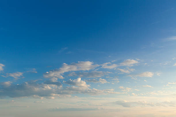 At sunrise, the sky and the colorful clouds.