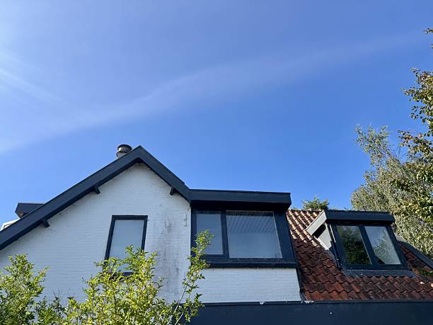 istock Traditional house with tiled roof and modern windows 2235453427