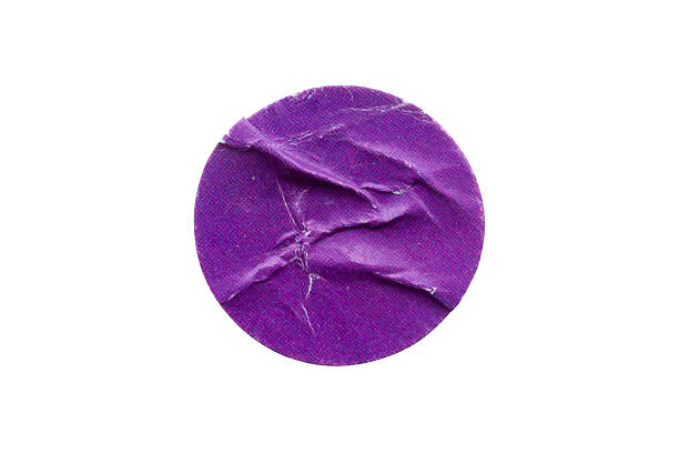 istock Blank purple round adhesive paper sticker label isolated on white background 2235454554