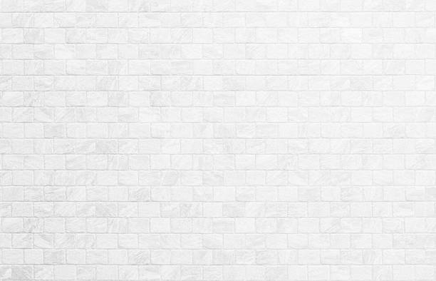 istock Wallpaper concept: Close up modern white brick tiles wall texture background. 2235454831