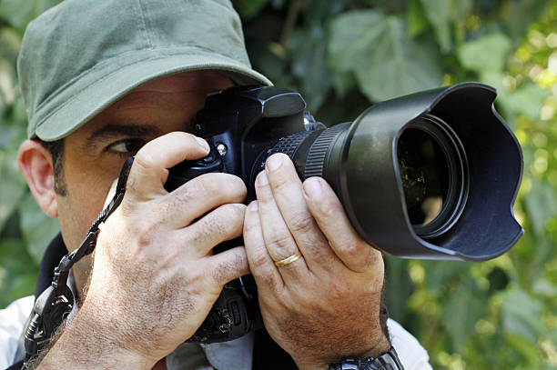 istock Documentary travel photographer hold a camera with a wide angle lens 2235457548