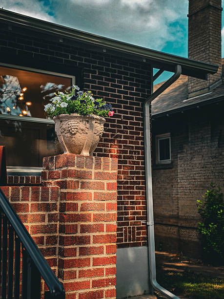 istock Brick Porch Column with Ornamental Flower Pot 2235457679