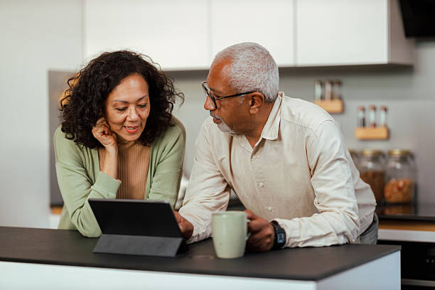 istock Happy Senior Couple Using Digital Tablet at Home 2235460595