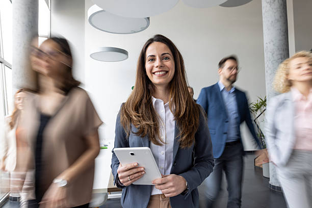 istock Smiling Businesswoman in Modern Office Environment 2235463506