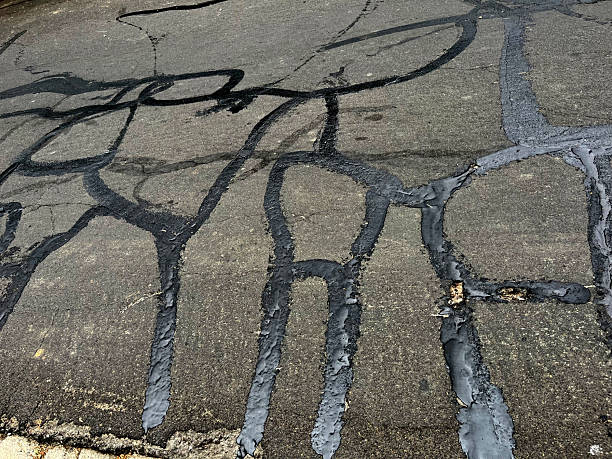 Asphalt road with filled cracks