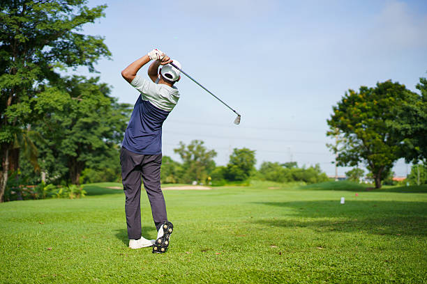 istock Asian golfer playing golf in morning. He playing a tee off shot. 2235482460