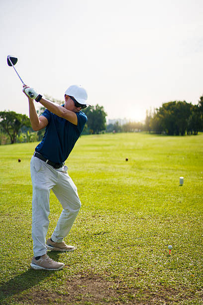 istock Asian golfer playing golf in morning. He playing a tee off shot. 2235482474