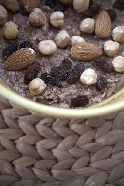 istock Chocolate oatmeal with hazelnuts, raisins and almonds 2235484947