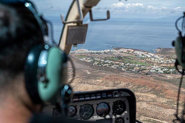 istock A pilot is flying a small plane over a city. 2235492692