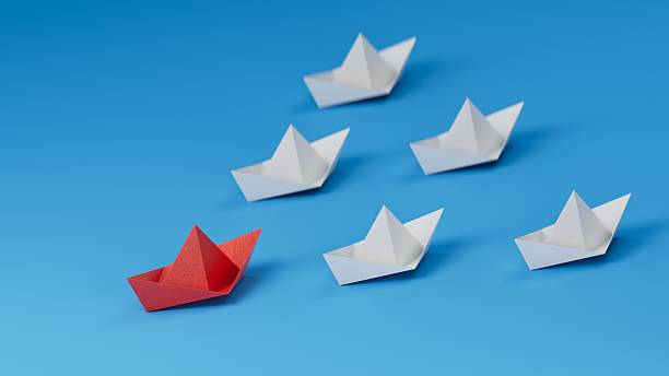 istock Red paper boat floating between others on light blue background, flat lay. Uniqueness concept.new ideas. paper art style. creative idea.3D rendering on blue background. 2235494767