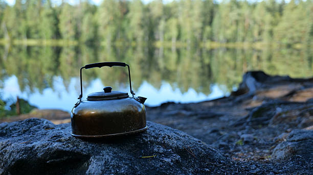 istock Kettle on Rock by Lake Water 2235498541