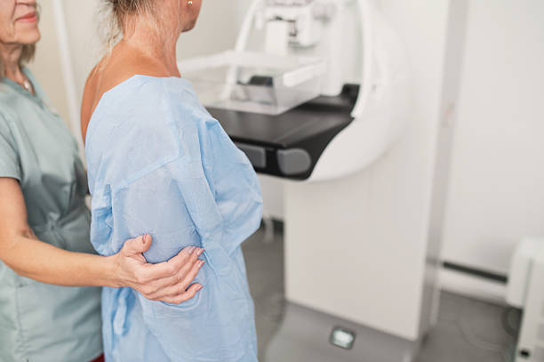 istock A nurse helps a patient undergo a mammogram procedure. 2235498600