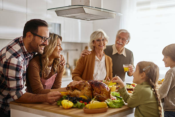 istock Happy multi-generation family preparing Thanksgiving lunch in the kitchen. 2235500611