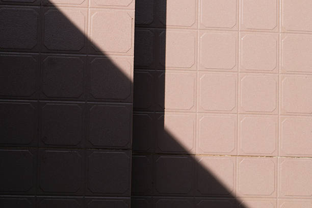 A powerful and graphic image focusing on the play of light and shadow. This high-contrast shot is perfect for modern design, architectural concepts, or as a minimal background.