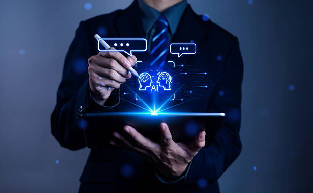 istock Businessman using digital tablet with glowing AI brain icons and chatbot technology, symbolizing artificial intelligence, machine learning, data analysis, and future innovation in business. 2235501783