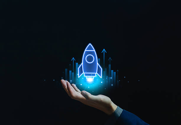 istock Hand holding glowing rocket icon with rising graph arrows, symbolizing startup growth, business innovation, technology development, future success, and financial investment opportunities 2235501828