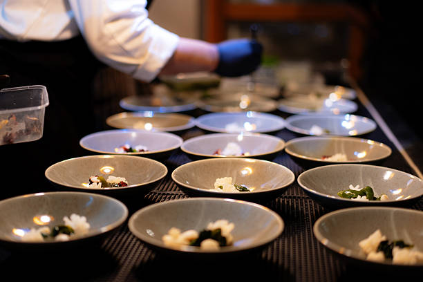 istock Chef's Hands Plating Multiple Gourmet Seafood Appetizers 2235502115
