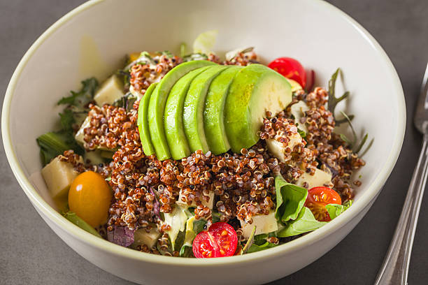 istock Fresh quinoa salad with avocado, cherry tomato and mixed greens 2235503950