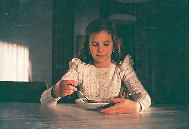 Beautiful girl eating. Shoot by film.