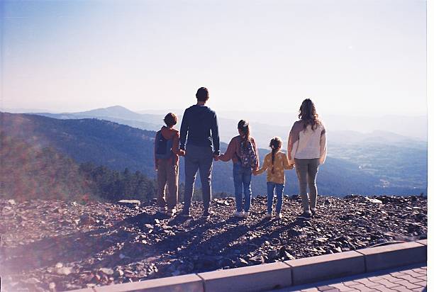Family enjoying mountain view. Shoot by film.