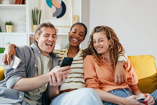 istock Young adults socializing and sharing online content 2235505141