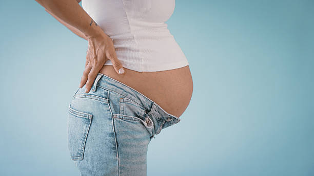 istock Pregnant Woman with Back Pain 2235505496