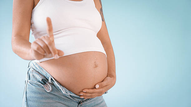 istock Pregnant Woman Gesturing No in Studio 2235505573