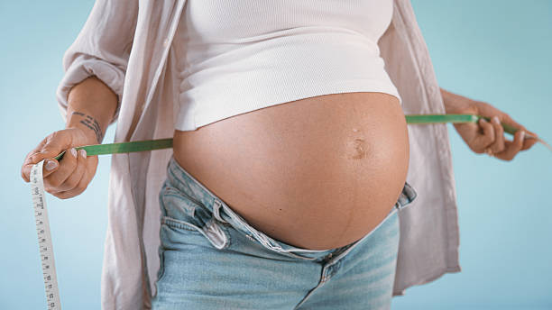 Pregnant Woman Measuring Belly