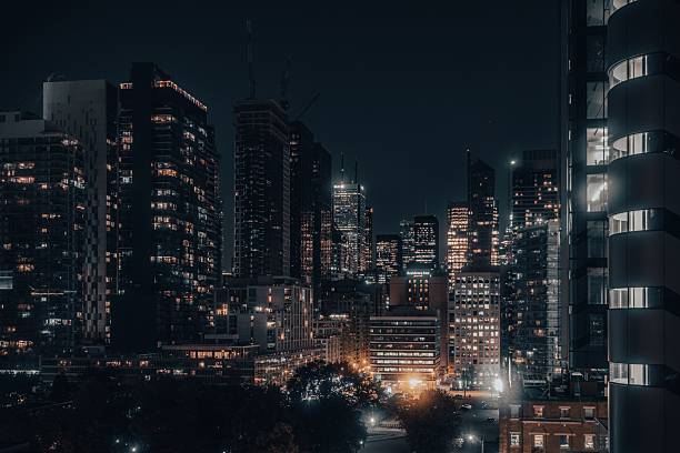 Toronto, Canada – June 28, 2023: A vibrant cityscape at night showcasing illuminated skyscrapers and urban architecture.