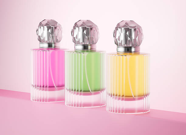 istock Three vibrant perfume bottles with elegant caps on a pastel pink background. 3d illustration 2235508306