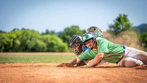 istock Baseball Player Sliding into Base, Catcher Attempting Tag 2235510122