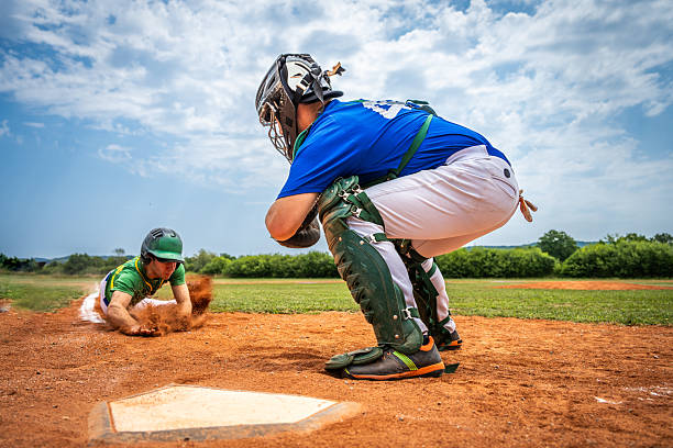 istock Baseball Player Slides into Home Plate 2235510129