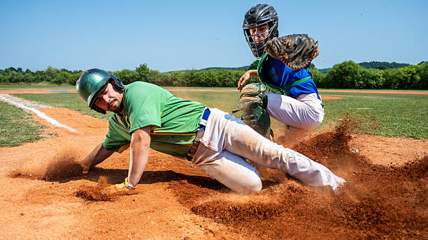 istock Medium Shot Intense Baseball Action at the Base 2235510154