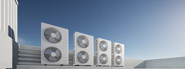istock 3D rendering panorama of utility infrastructure for building cooling systems on concrete floor or rooftop. Condenser units and industrial HVAC equipment for heat ventilation and climate control. 2235513155