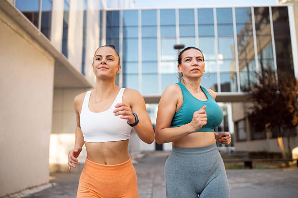 istock Women jogging as a pair during an outdoor run 2235516222