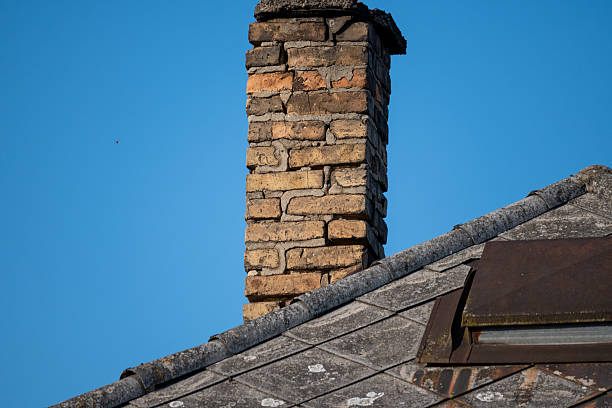 istock Old house roof with chimney 2235518827