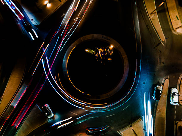 Light trails caused by fast movement during a long exposure of busy commuter traffic on the  motorway and connecting roads in central Glasgow, Scotland.
