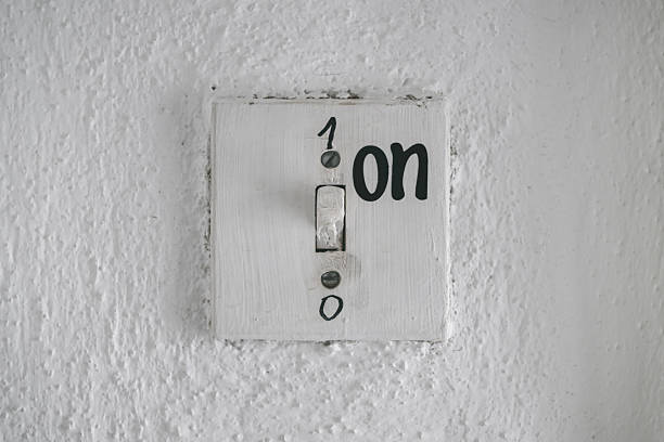 istock Old vintage rustic light switch on wall with numbers 1 for on and 0 for off. 2235521700