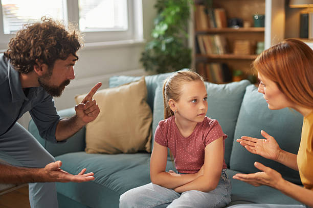 istock Parents scolding daughter at home 2235521721