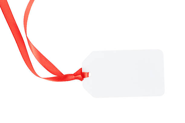 istock blank white christmas tag with red ribbon isolated on white 2235522321